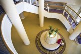 University-House-Issaquah-senior-living-entrance-main-lobbygrand-staircase-Era-Living[1]